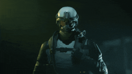 a man wearing a helmet and goggles looks at the camera