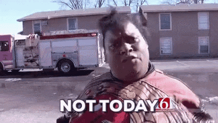 a man in a spiderman suit is standing in front of a fire truck and says not today .