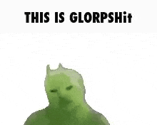 a green cat with the words `` this is glorpshit '' written on it is laying on its back .