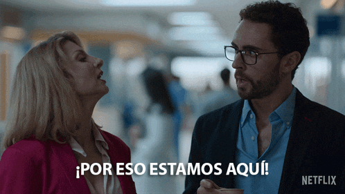 a man and a woman are standing next to each other with netflix written on the bottom