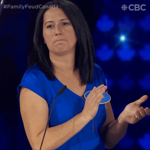 a woman wearing a blue shirt with nancy on it