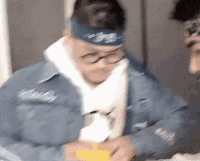 a blurry picture of a man wearing a blue headband