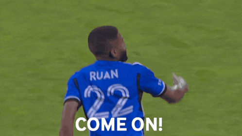 a soccer player in a blue jersey with the number 22 on it