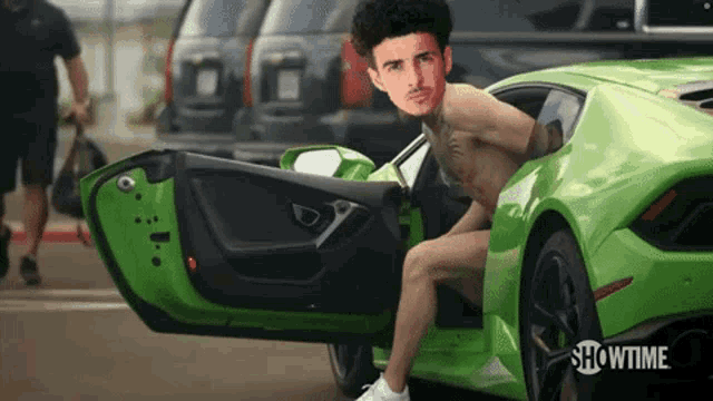 a man without a shirt is sitting in a green showtime car