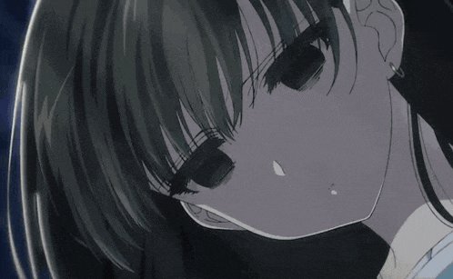 a close up of a girl 's face with a tear running down her cheek