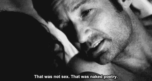 a black and white photo of a man and a woman having sex .