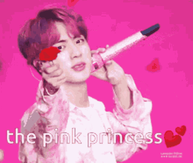 a man with pink hair is holding a pink microphone with the words " the pink princess " written below him