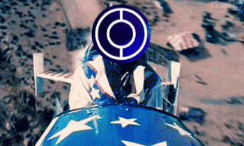 a person is riding a motorcycle on a beach with a blue and white flag on the back .