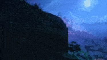 a computer screen shows a landscape with trees and a full moon