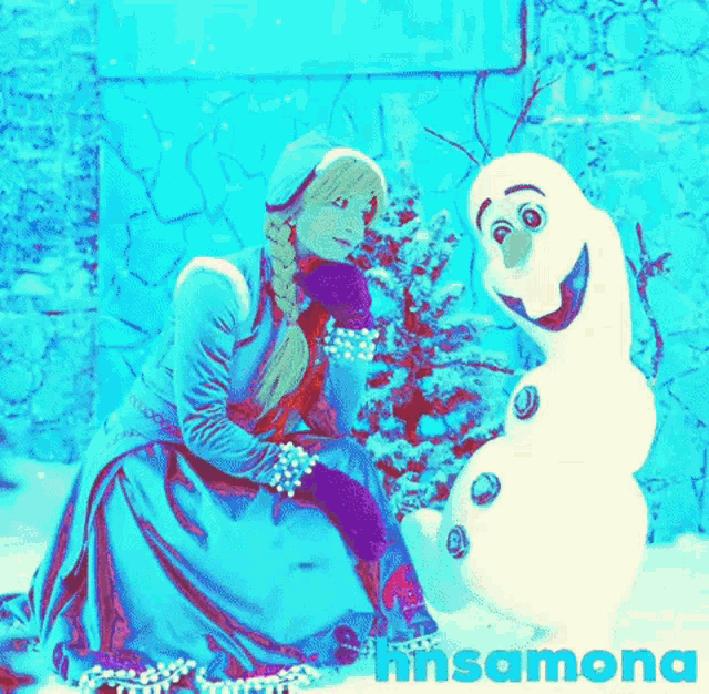 a woman in a frozen costume sits next to an olaf