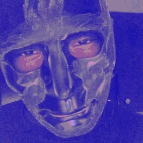 a close up of a person wearing a mask