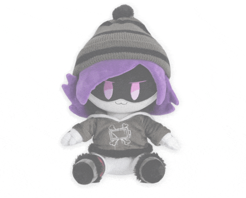 a stuffed animal with purple hair is wearing a hoodie and a hat