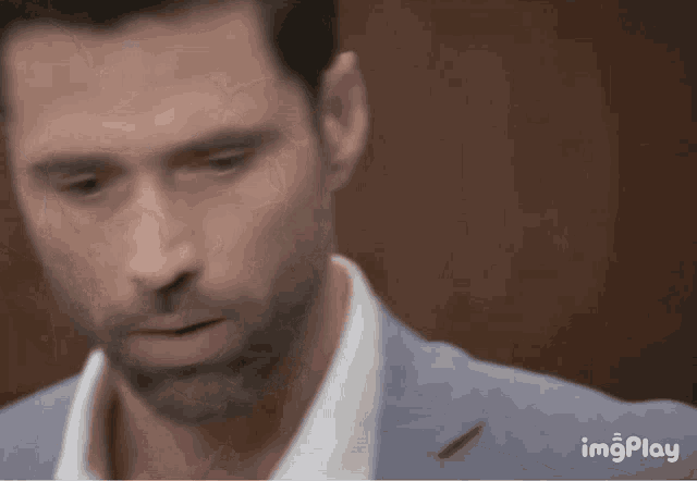 a close up of a man 's face with the words imgplay visible in the corner