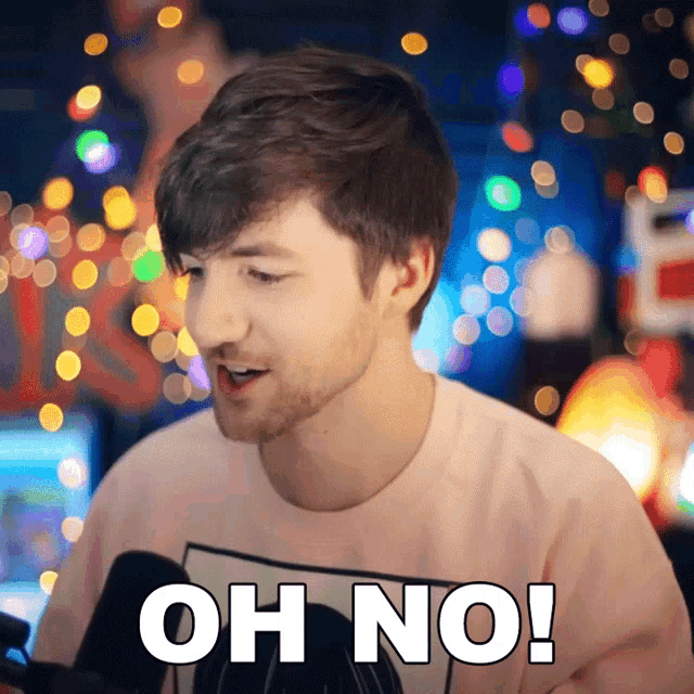 a man wearing a pink shirt with the words oh no on it