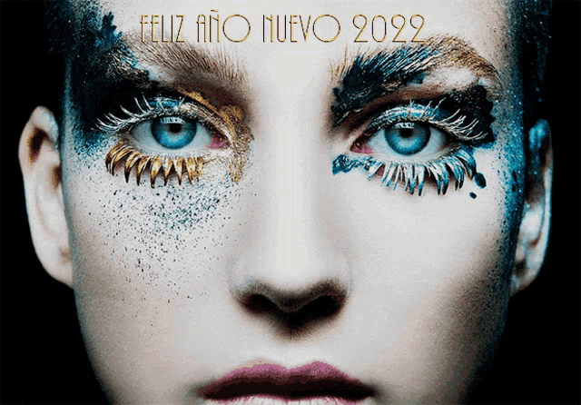 a close up of a woman 's face with feliz ano nuevo 2022 written above her eyes