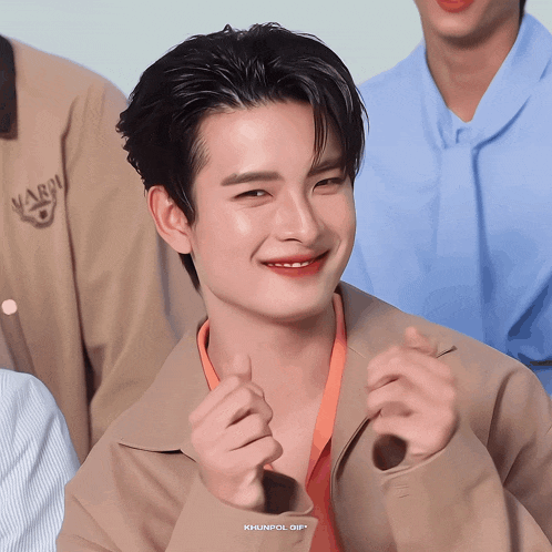a close up of a man 's face with khunpol gif on the bottom