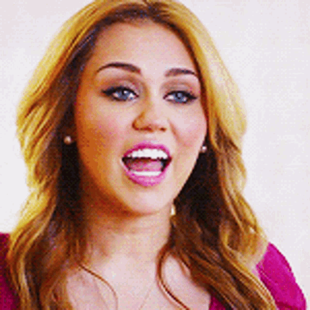 a close up of a woman with her mouth wide open