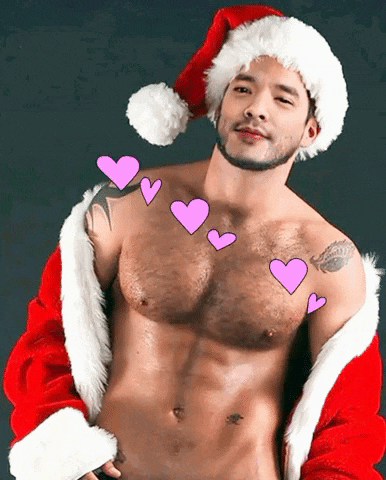 a shirtless man dressed as santa claus with pink hearts floating around him