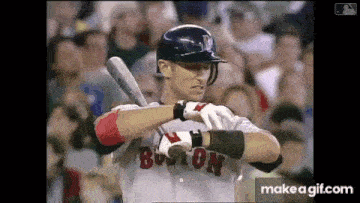 a baseball player in a boston uniform is holding a bat .