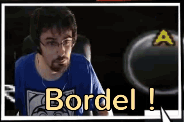 a man wearing glasses and headphones is sitting in front of a screen that says bordel .