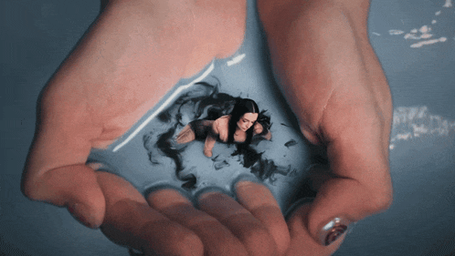 a woman holding a picture of a woman in a bathtub