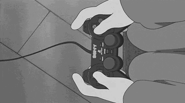 a person is playing a video game with a playstation controller in their hands .