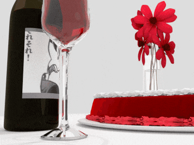 a bottle of wine next to a glass of wine and a red cake