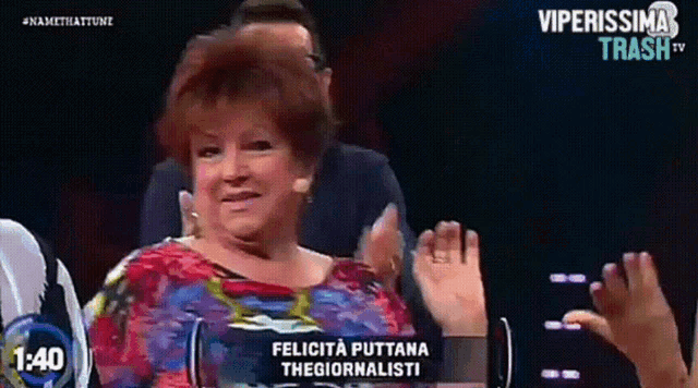 a woman applauds on a tv show called felicita puttana thegiornalisti