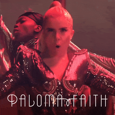 a poster for paloma faith shows a woman in a red dress