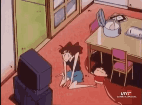 a woman is kneeling on the floor in front of a television in a cartoon .