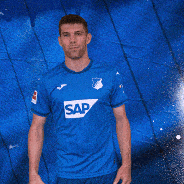 a man in a blue shirt with the word sap on the front