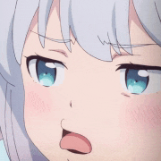 a close up of a girl with white hair and blue eyes making a funny face