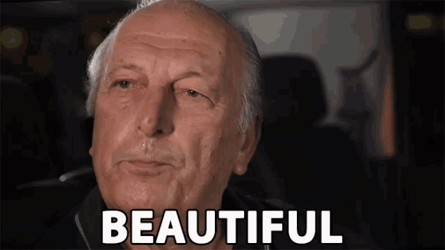 an older man is sitting in a car and says beautiful