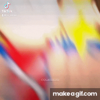 a blurred image of a person holding a toothbrush with the words make a gif.com written below it .