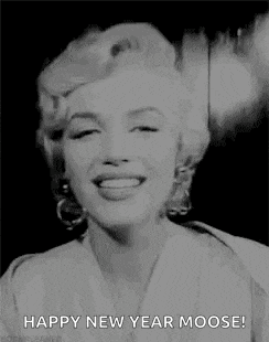 a black and white photo of a woman smoking a cigarette and saying happy new year moose .