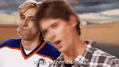 two men are standing next to each other and one of them is wearing a number 7 jersey