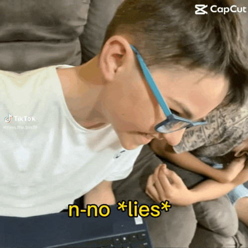 a boy wearing glasses says n-no lies