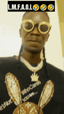 a man wearing sunglasses and a shirt that says l.m.f.a.o.l. on it