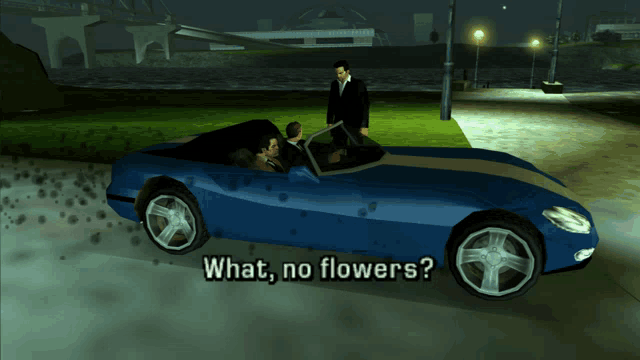 a blue car with the words " what no flowers " on the side
