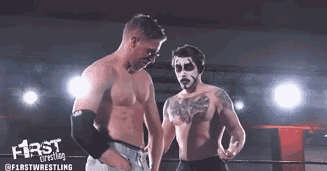 two men wrestling in a ring with the words first wrestling on the bottom right