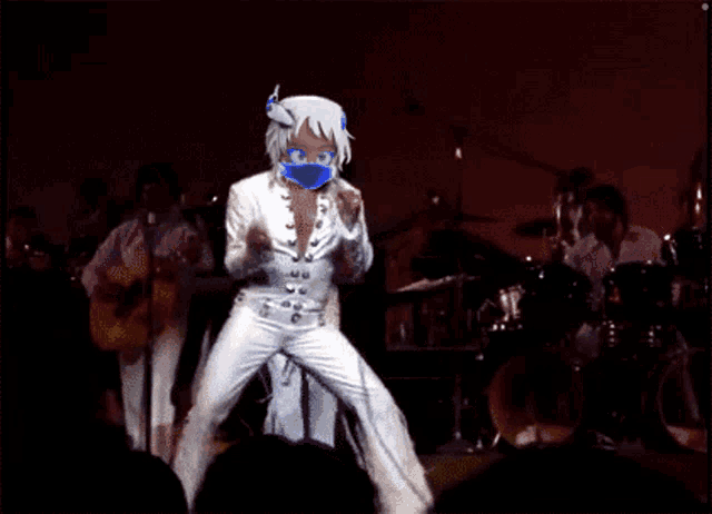 a cartoon of a woman wearing a mask dancing on stage