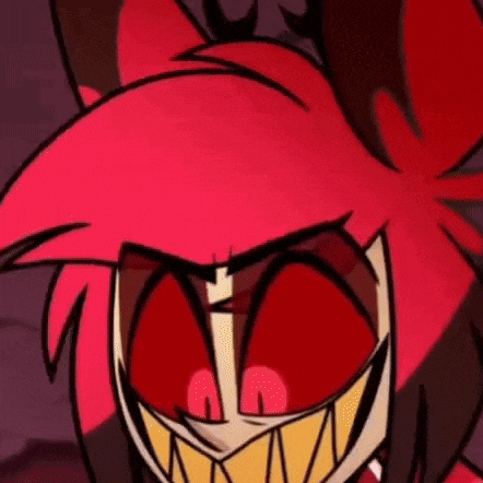 a close up of a cartoon character with red eyes and huge teeth .