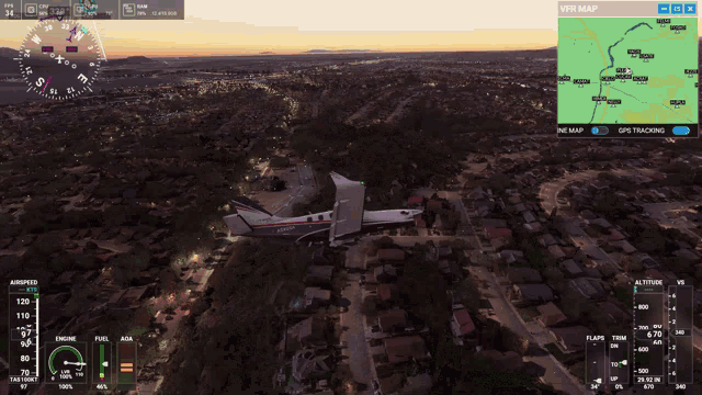 a computer screen shows a plane flying over a residential area with a vtr map displayed