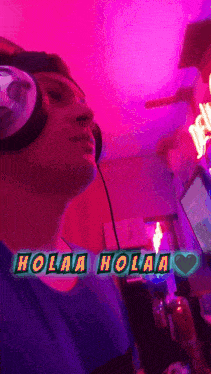 a man wearing headphones with the words holaa holaa written on it