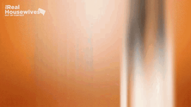 a real housewives advertisement with a blurred background