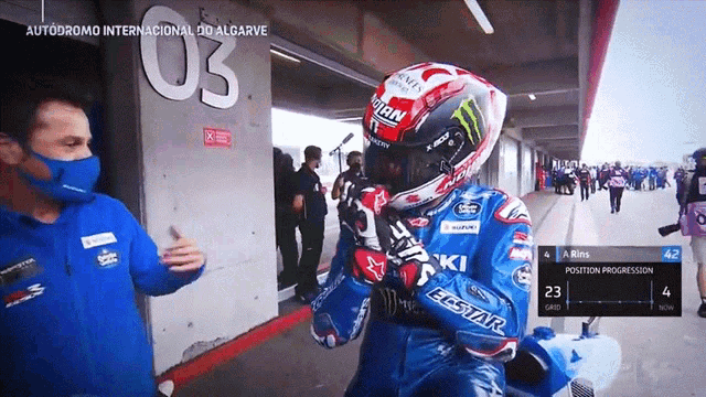 a motorcycle racer wearing a helmet that says iran on it