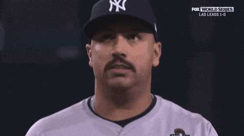 a man with a mustache wearing a world series shirt