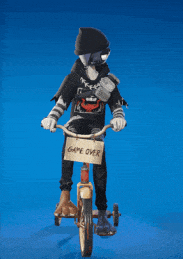 a cat is riding a tricycle with a sign that says game over on it