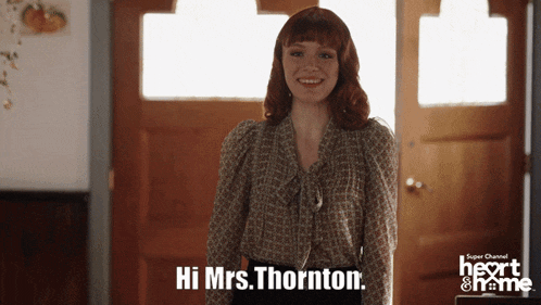 a woman stands in front of a door and says hi mrs thornton