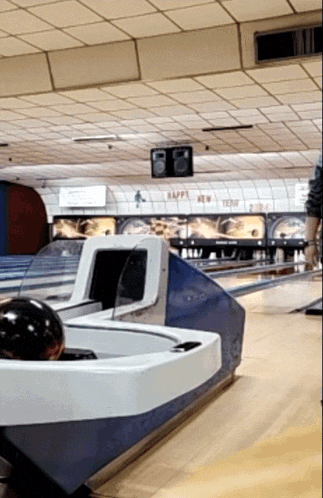 a bowling alley that says happy new year on the ceiling